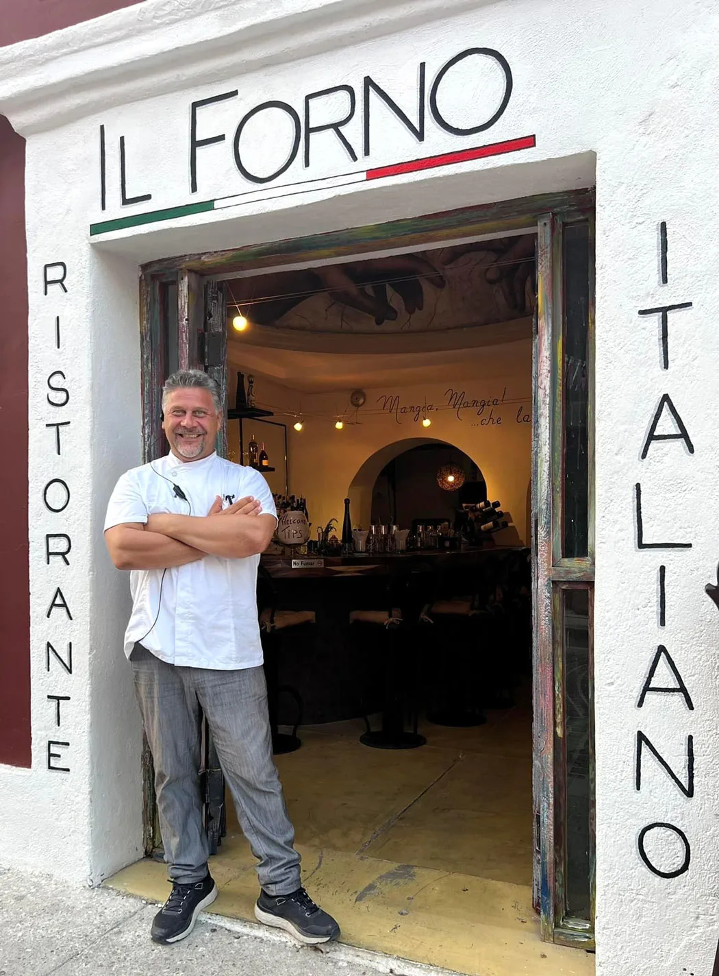 Chef in white shirt outside Il Forno, Cabo San Lucas