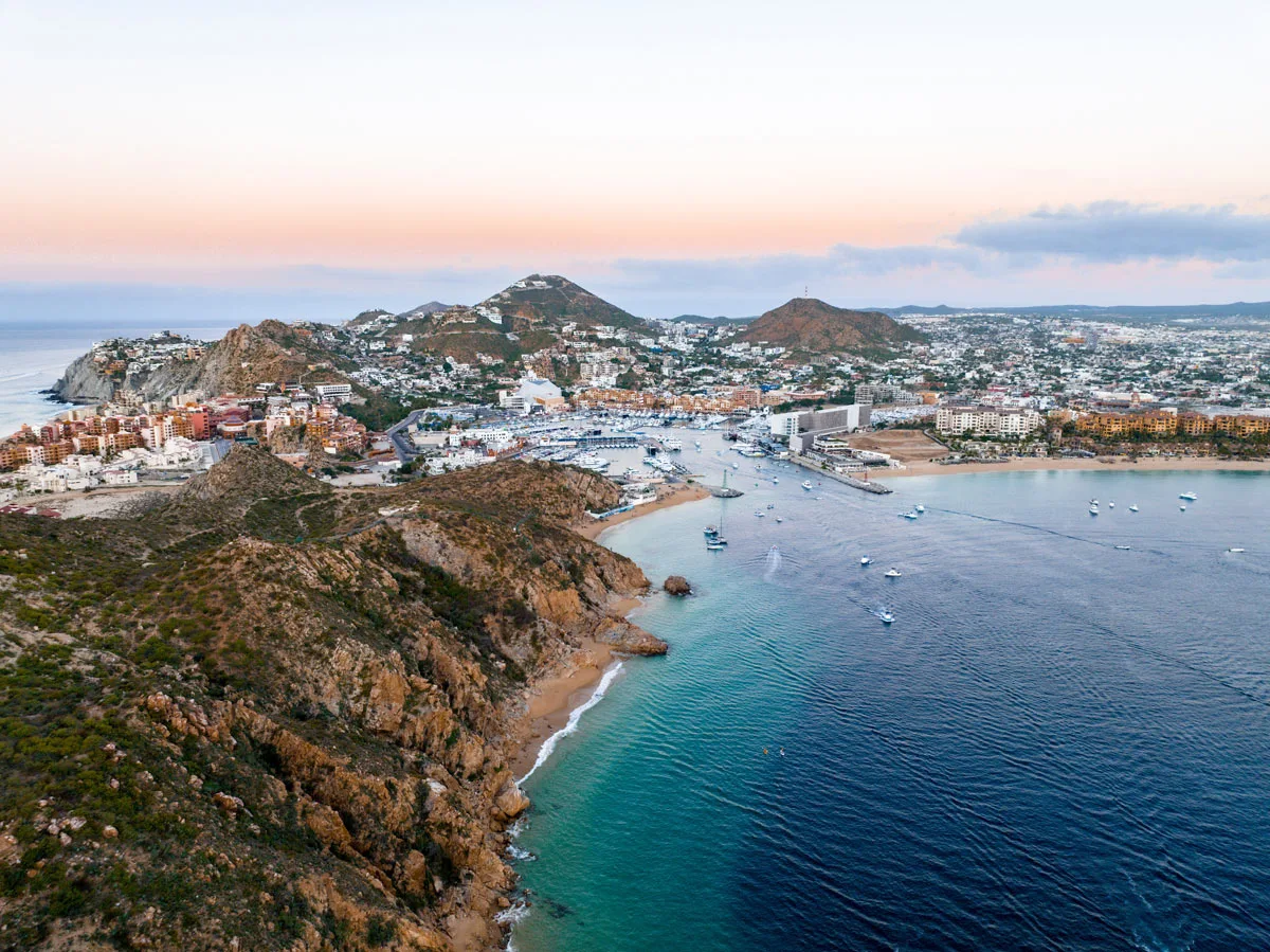 The town of Cabo San Lucas spreads out around the marina, up into Pedregal Hill and behind Medano Beach.