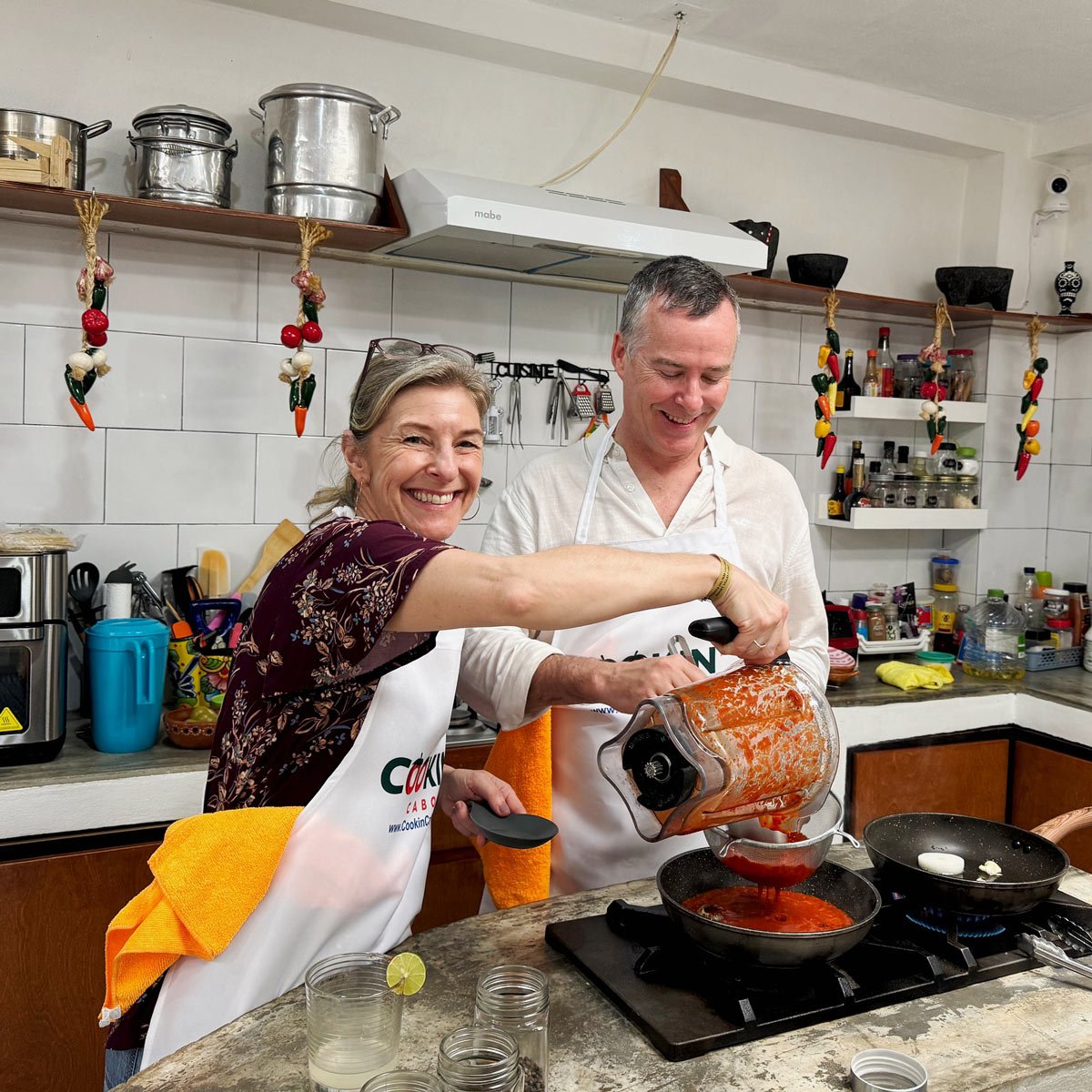 Smiling couple at a Cabo San Lucas Mexican cooking class