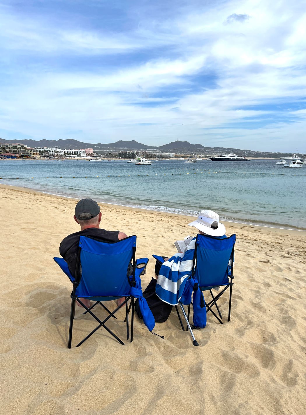 Couple reading on the beach in January