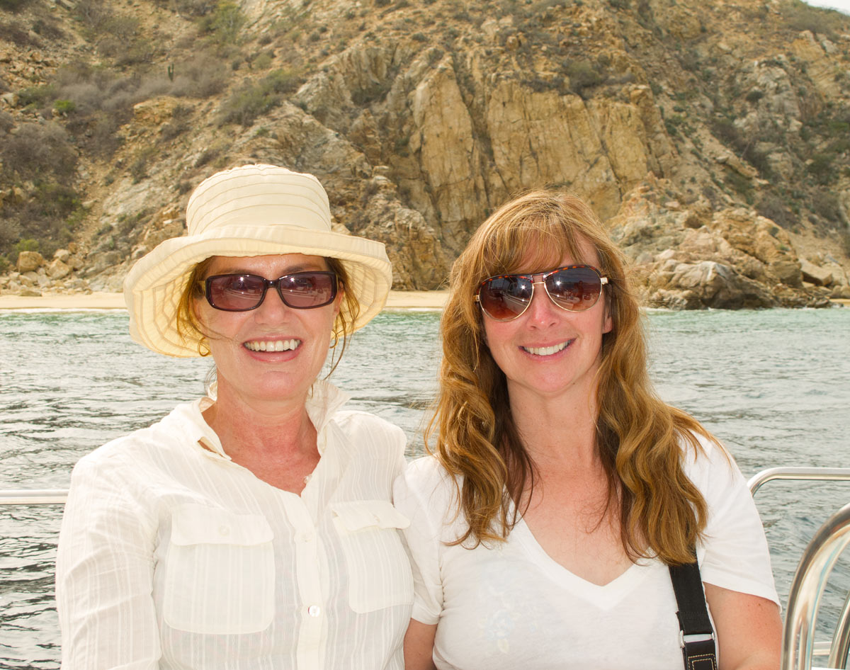 Two smiling ladies on a boat trip in Cabo San Lucas