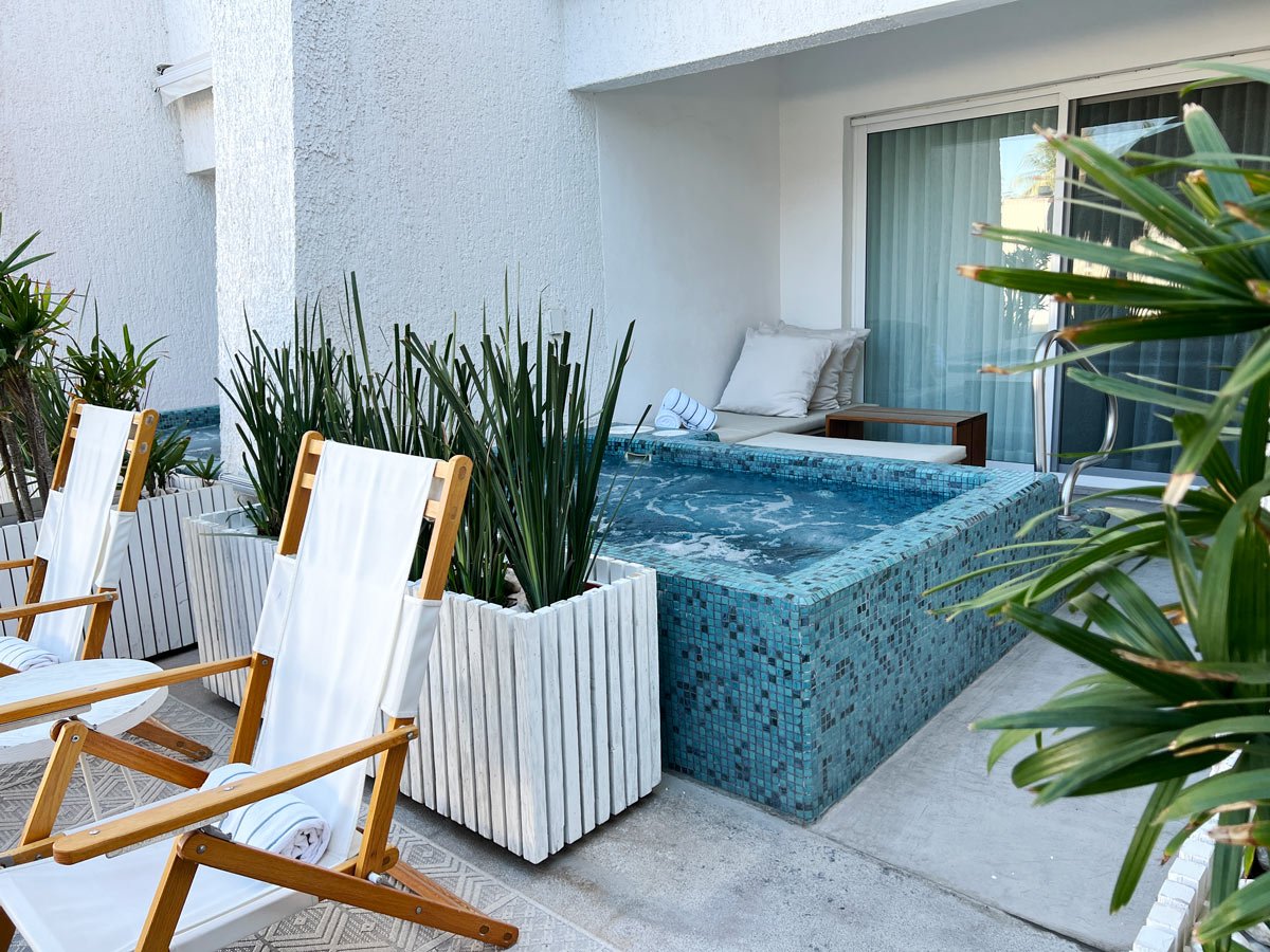A ground-floor poolside suite at Bahia Hotel & Beach House, with its private jacuzzi on the patio