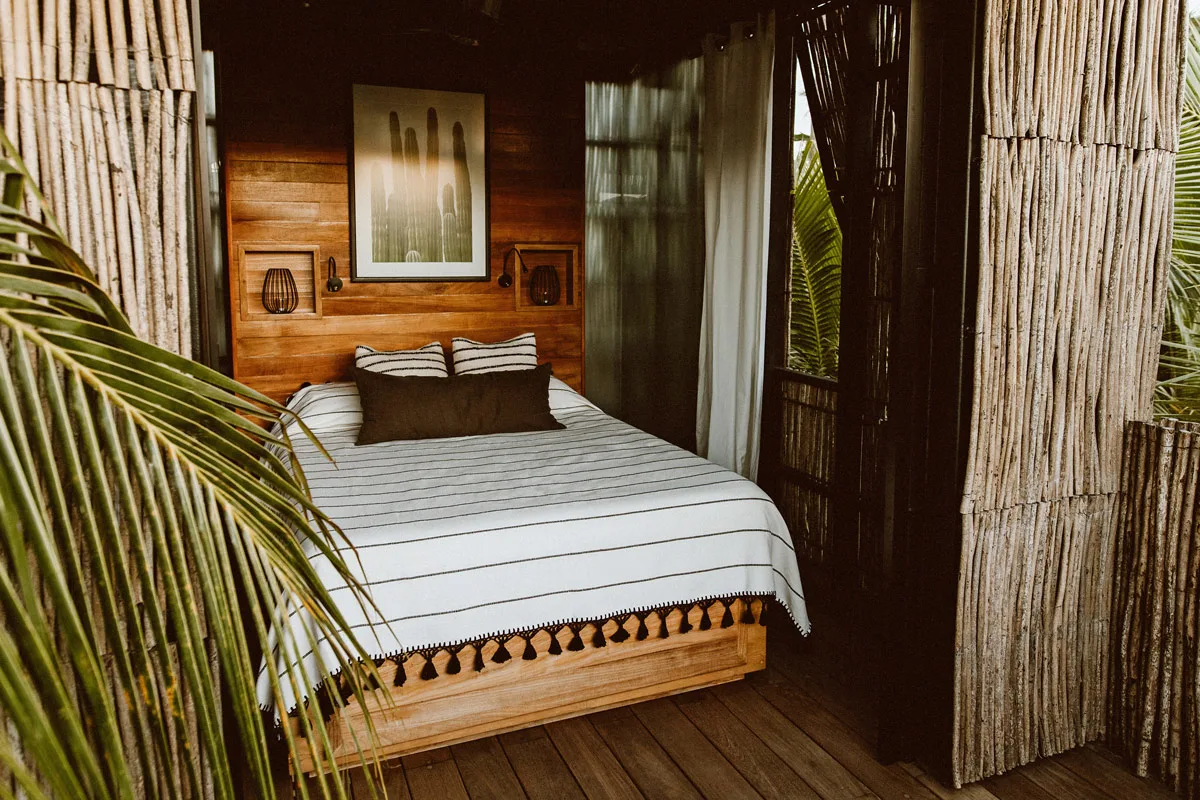 Treehouse bedroom with king bed at Acre Resort