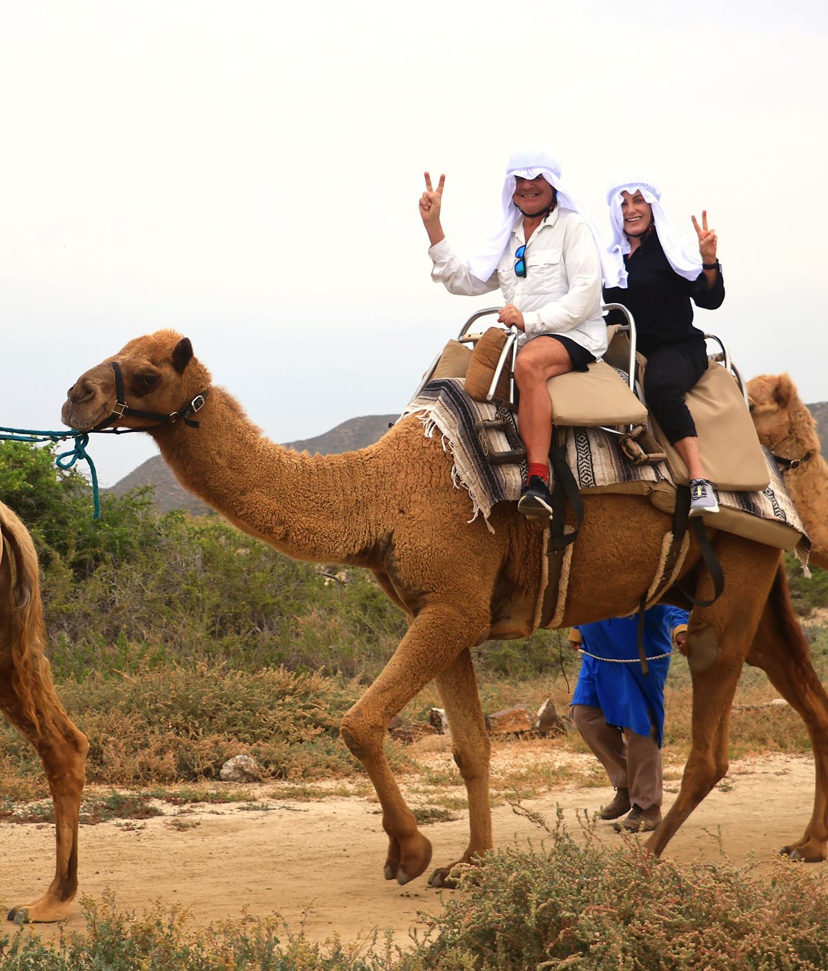 Couple riding a camel in Cabo San Lucas