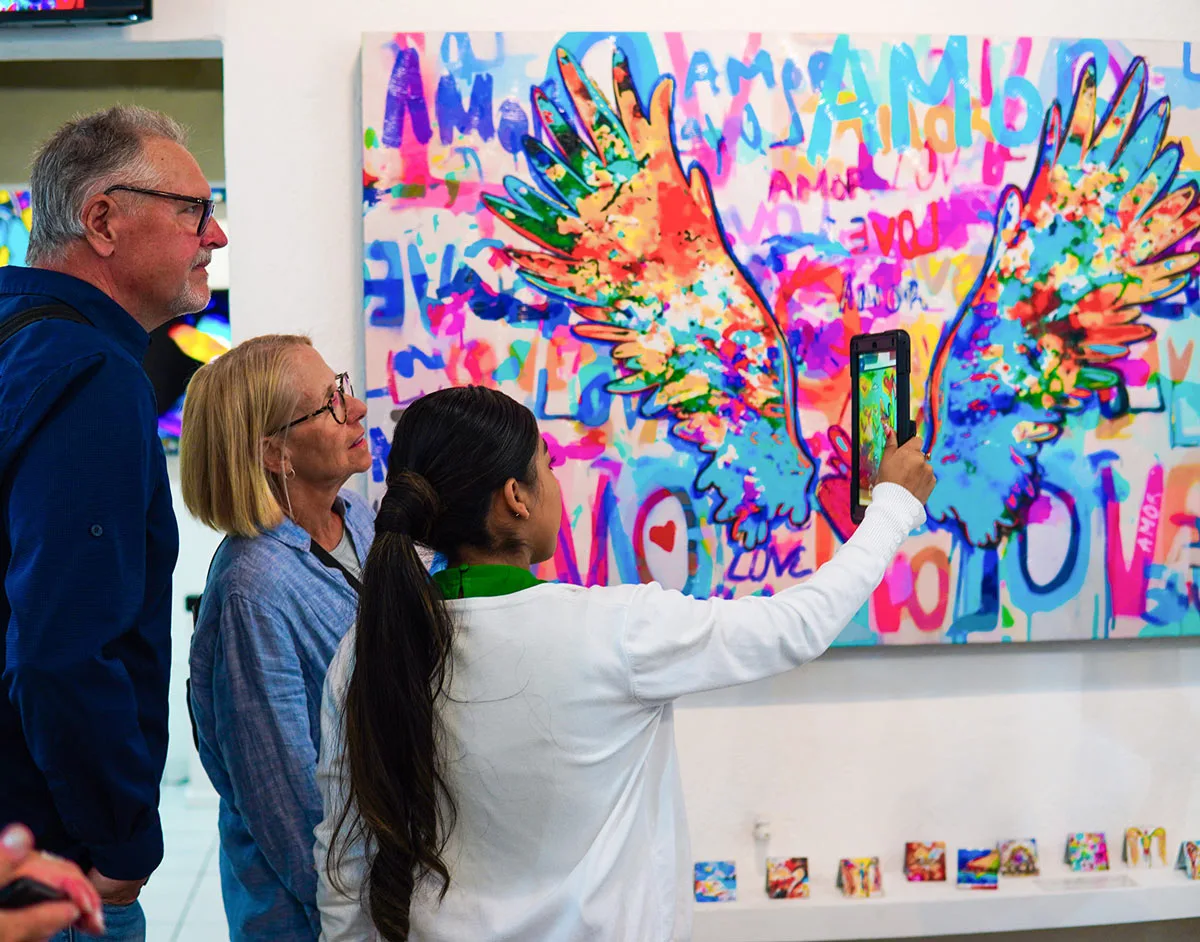 Visitors admire art in a San Jose del Cabo gallery during Art Walk.
