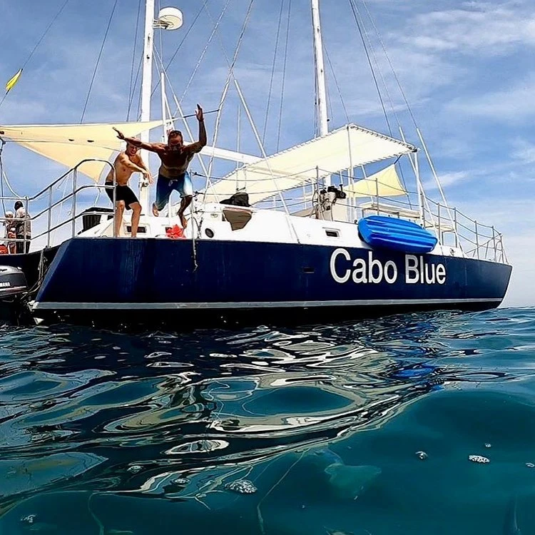 Man jumping of a Cabo Blue trimaran
