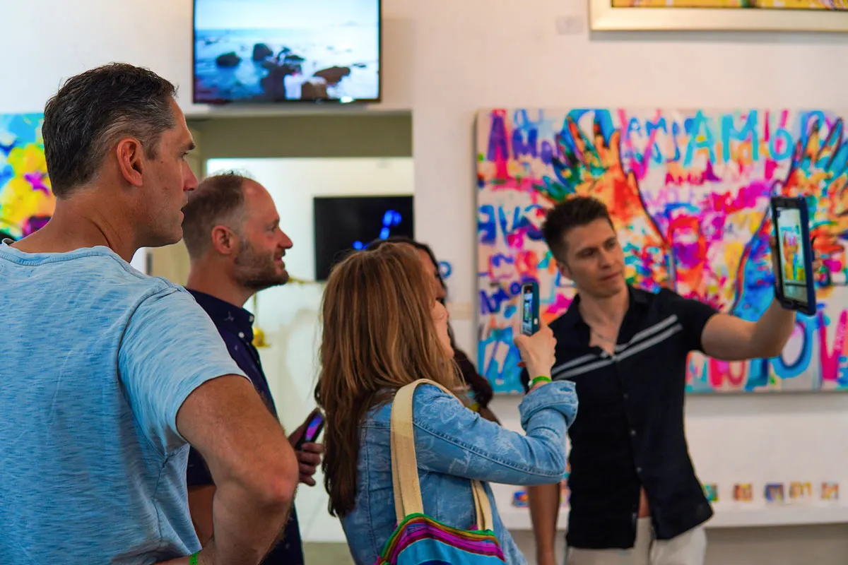 Visitors enjoy the gallery art on the Thursday evening San Jose del Cabo Art Walk.