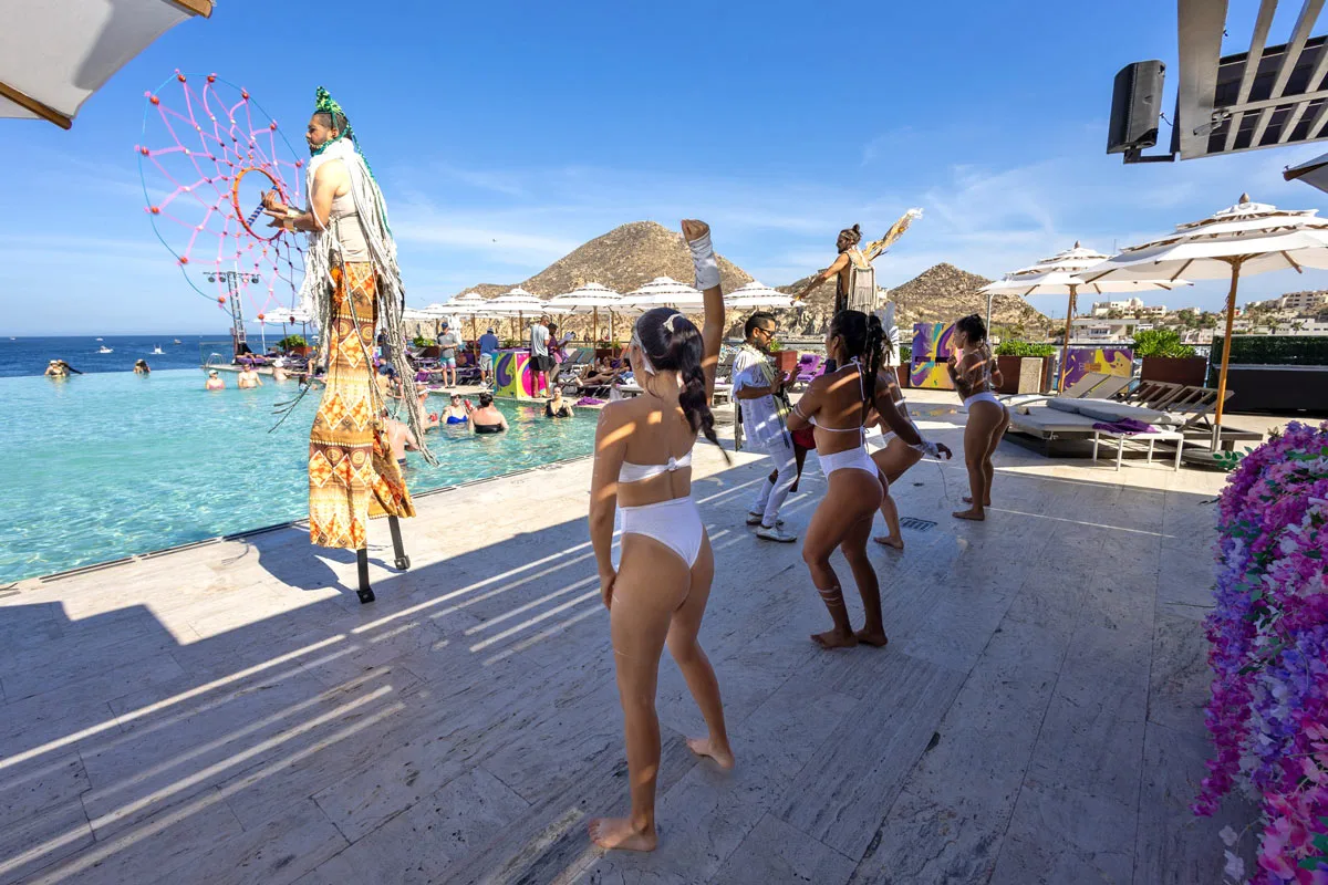 Pool party with dancers in bikinis at Breathless Beach Club in Cabo San Lucas