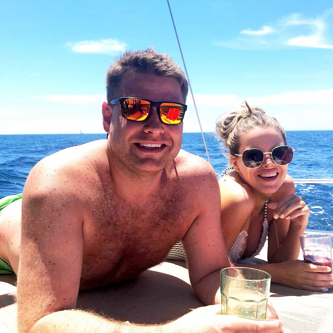 Smiling couple on a sailboat in Cabo San Lucas