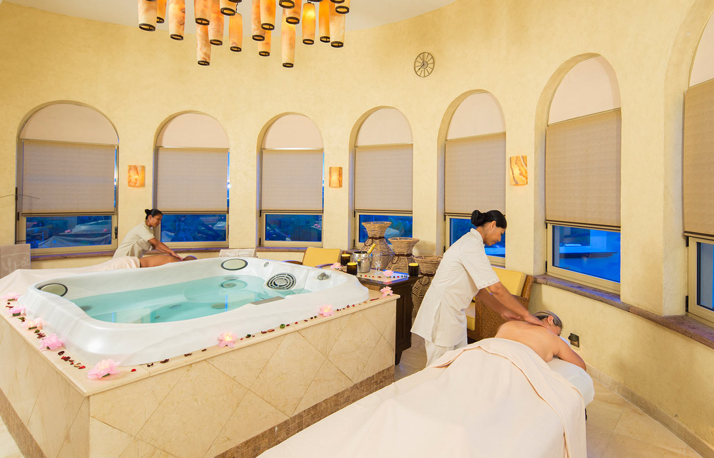 Therapists giving couples massage at Cabo San Lucas Desert Spa at Villa del Arco.
