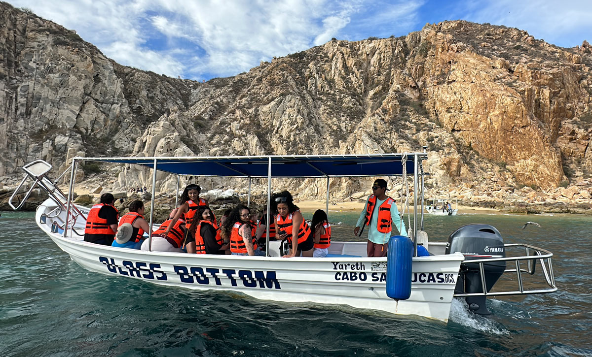 Visitors enjoy a glass-bottom boat ride to Land's End