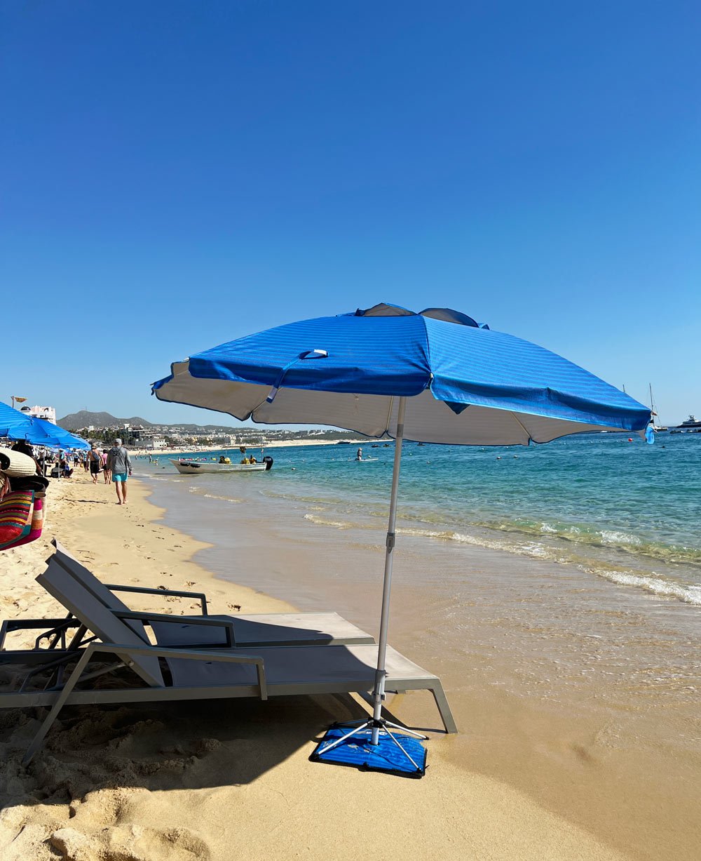 Two loungers and an umbrella for rent on Medano Beach