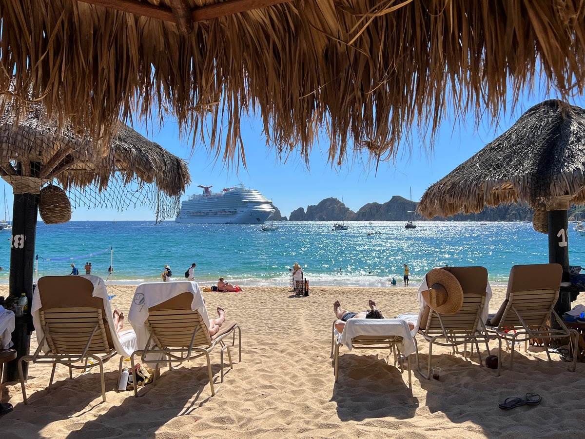 A Carnival cruise ship anchored off Medano Beach