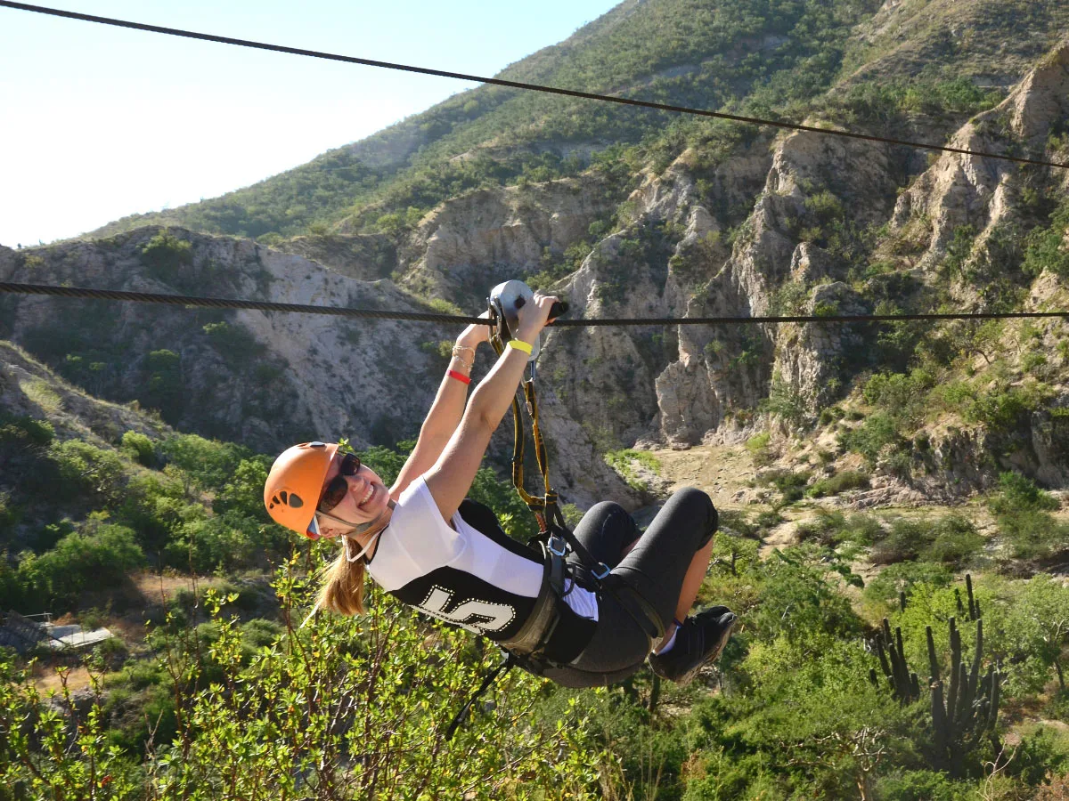 Young woman ziplining in Cabo San Lucas