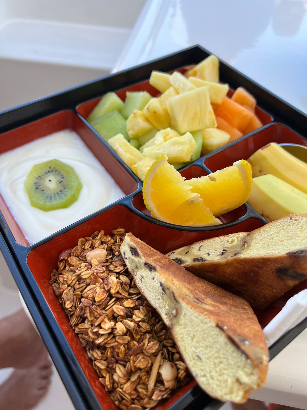 Breakfast of cinnamon rolls, fruit and yogurt on Balandra Bay day trip with Cabo Adventures