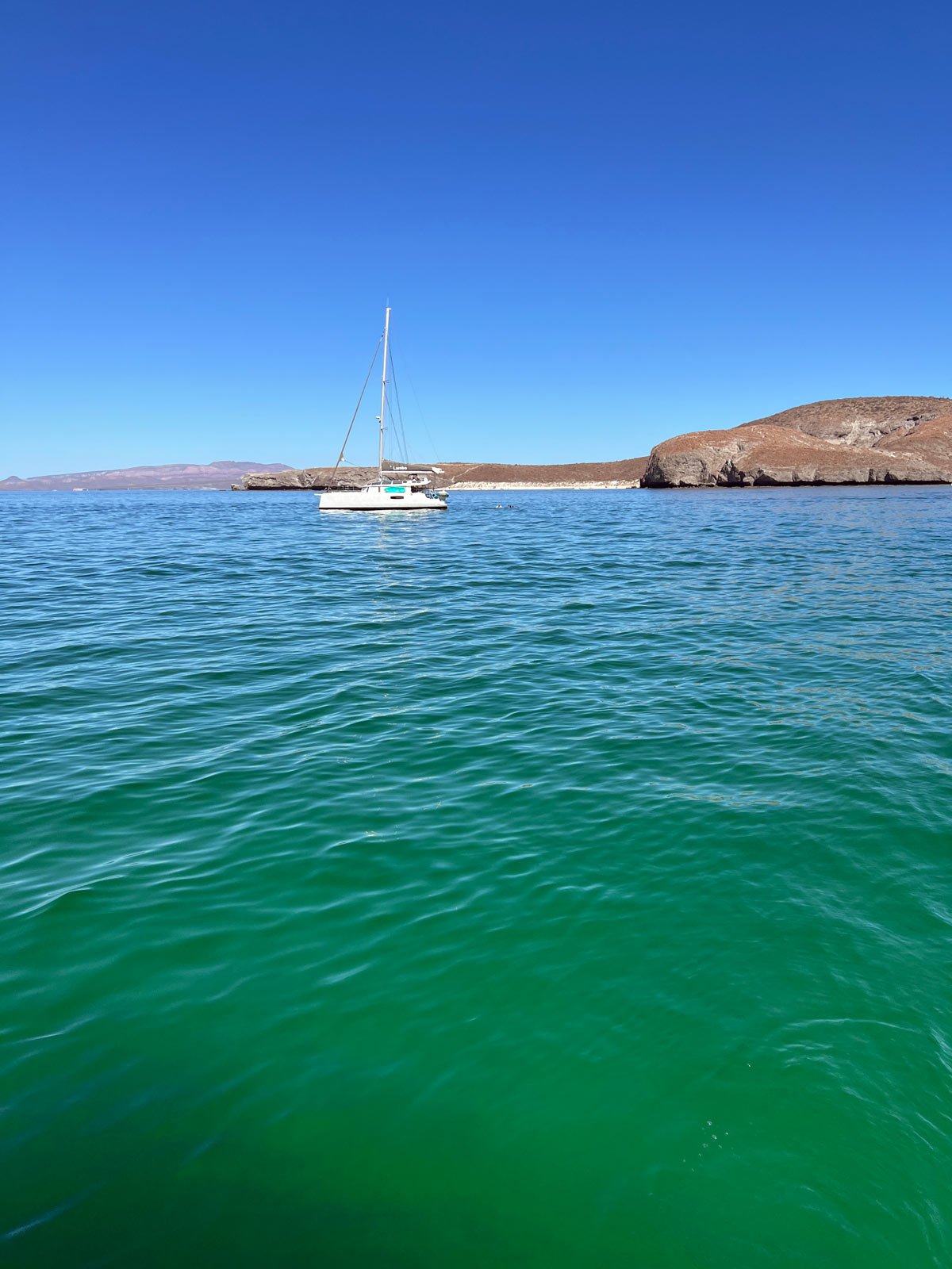 Sailboat in turquoise sea of Balandra Bay