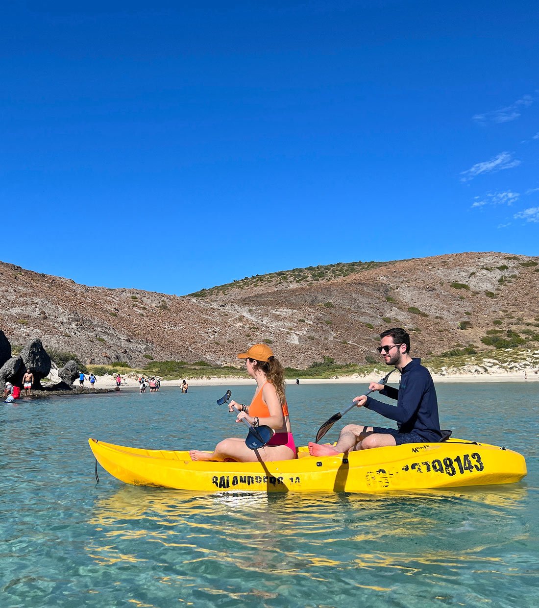 A young couple sea kayaking in Balandra Bay