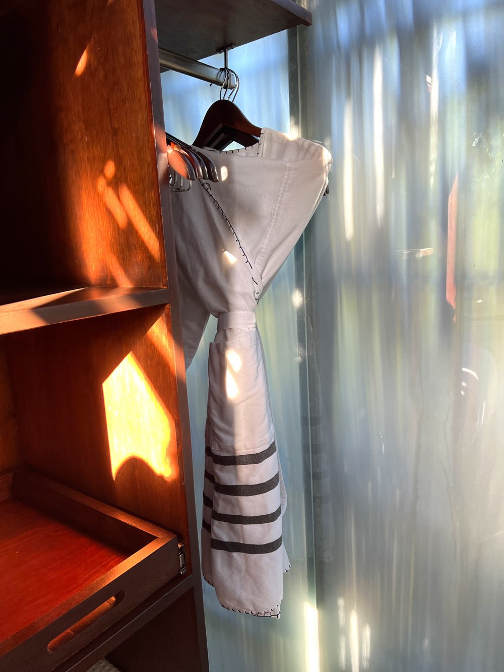 Closet with dressing gown in an Acre treehouse