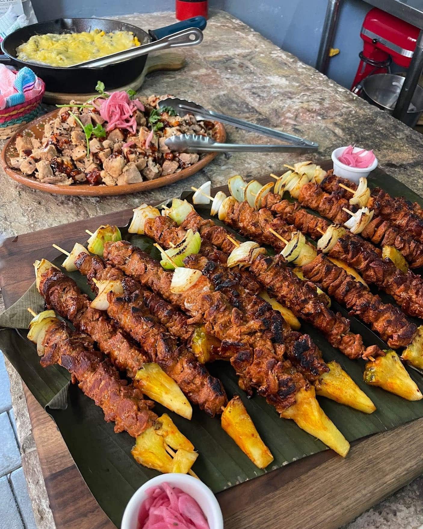 Al pastor-style pork skewers with pineapple at Cookin' Cabo class