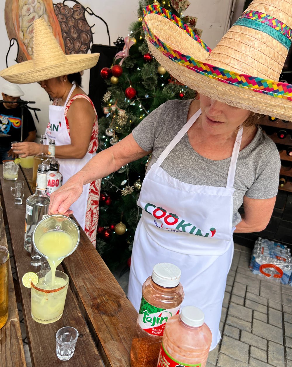 Janice pouring lime juice for margaritas