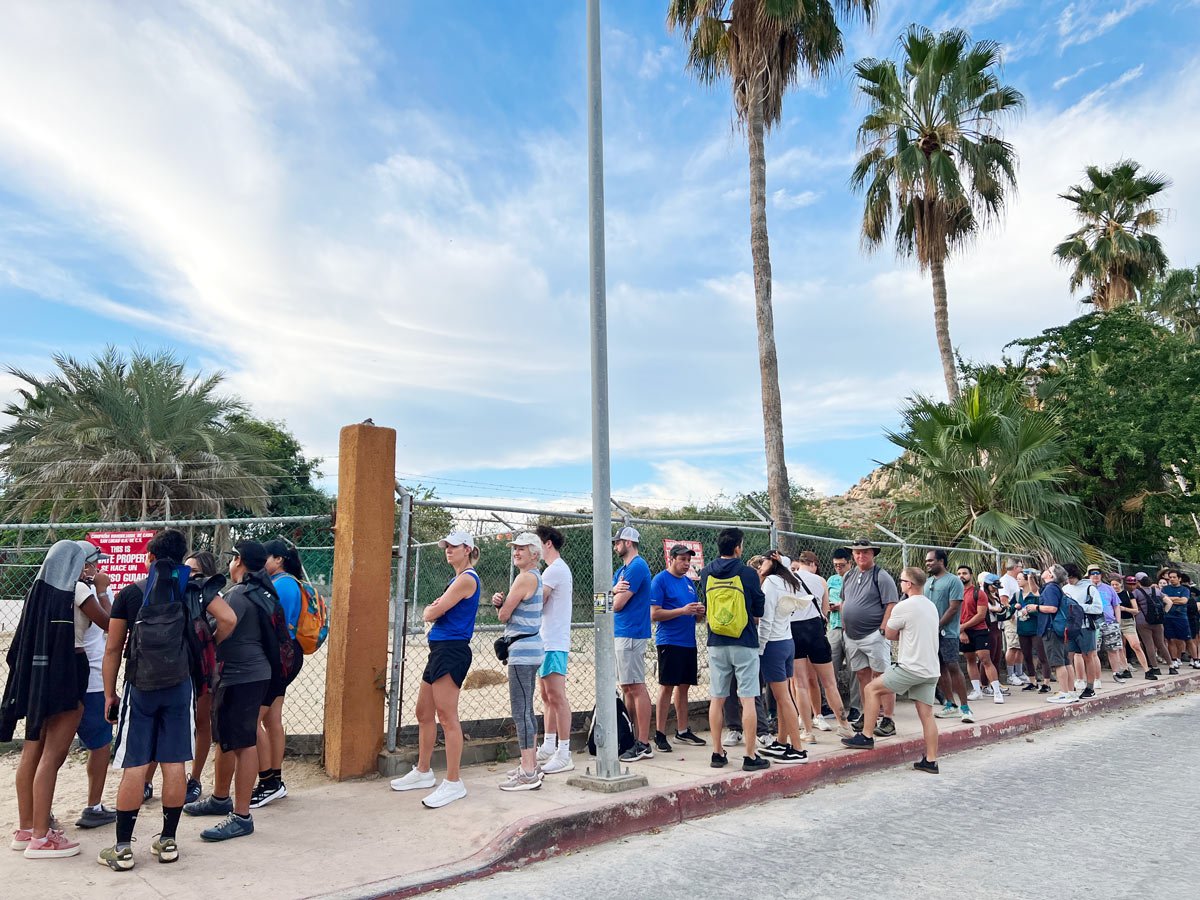 A long line of hikers waiting on the street for the Mt. Solmar hike